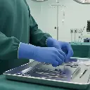BLUE 5MIL NITRILE GLOVES IN MEDICAL USE.webp